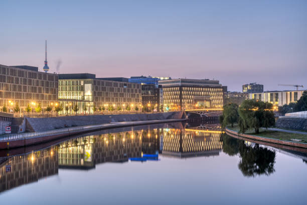 istock Modern office buildings at the river Spree in Berlin at dawn 1343583483