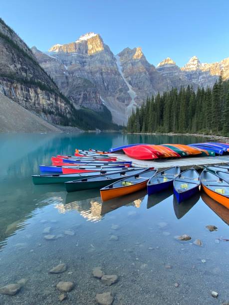 istock Moraine lake canoes at dawn 1343583820