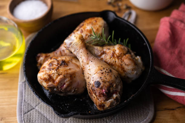 istock baked chicken drumsticks in iron skillet pan 1343585634