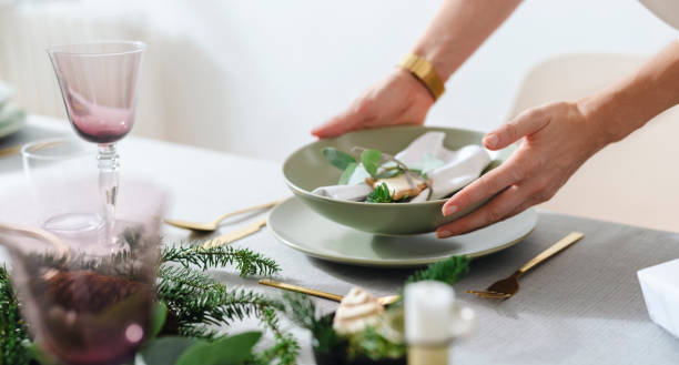 istock Christmas Celebration: An Anonymous Woman Setting Up Christmas Dinner Table 1343587133