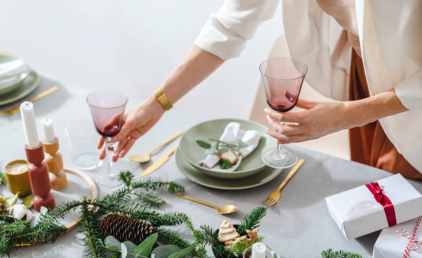 istock An Anonymous Woman Setting Up Christmas Dinner Table 1343587136