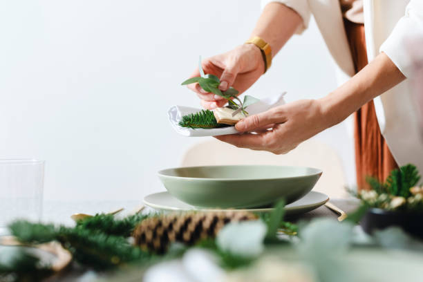 istock Christmas Celebration: An Anonymous Woman Setting Up Christmas Dinner Table 1343587138