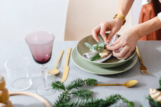 istock Christmas Celebration: An Anonymous Woman Setting Up Christmas Dinner Table 1343587139