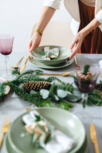 istock An Anonymous Woman Setting Up Christmas Dinner Table 1343587147