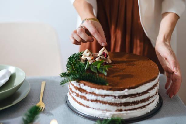 istock Christmas Preparation: An Anonymous Woman Setting Up Christmas Dinner Table 1343587178