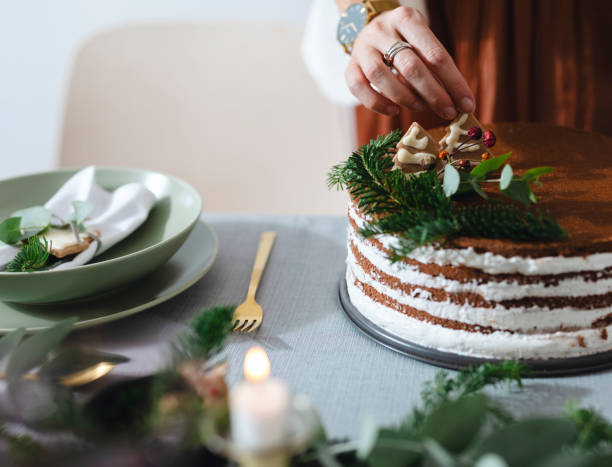 istock Christmas Preparation: An Anonymous Woman Setting Up Christmas Dinner Table 1343587183