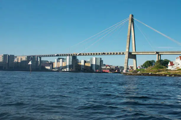 Photo of View of downtown Stavanger Norway and bridge from the ocean. Popular cruise destination for accessing famous Trolltunga and Kjerag Hikes