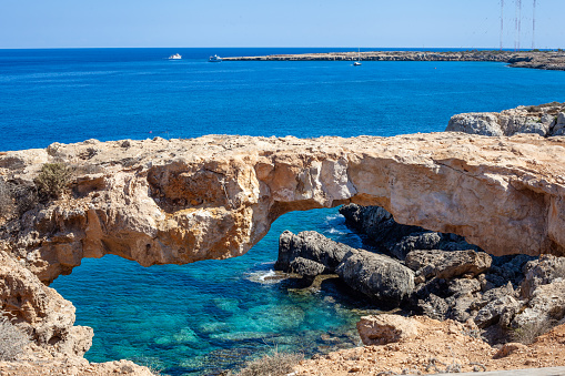 The bridge of love.  Natural rock formation in the shape of a bridge in the town of Ayia Napa, Cyprus.  Captured in September 2023.