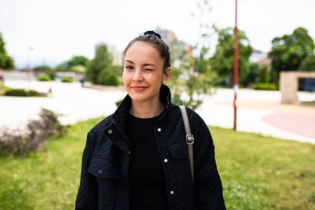 istock A beautiful young woman winking at the camera 1343591800