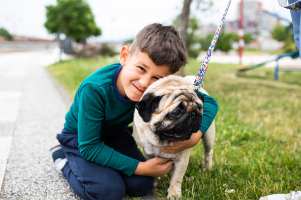 istock A cute boy hugging his small dog 1343591818