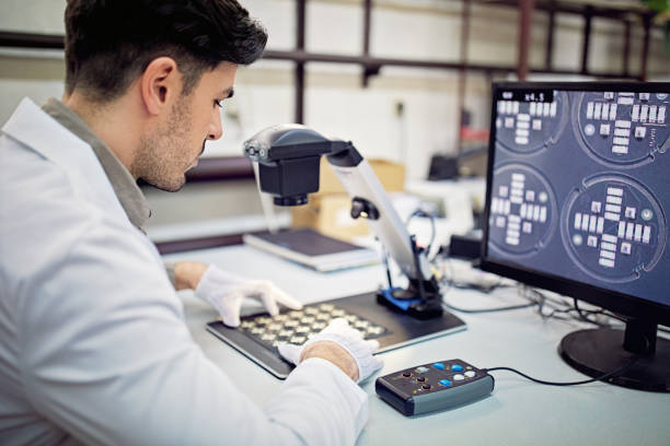 Man is working in circuit board factory stock photo
