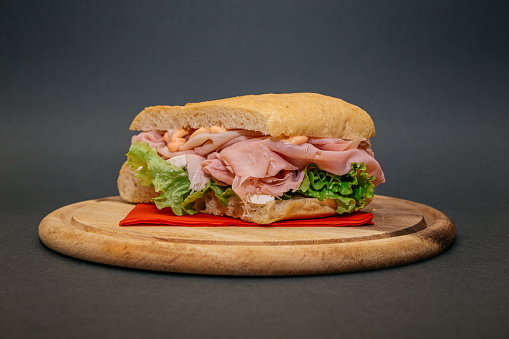 Delicious vegetarian  sandwich on wooden restaurant table