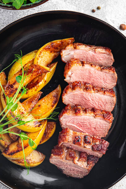 istock duck breast meat and garnish poultry second course fresh meal snack on the table copy space food background 1343595679