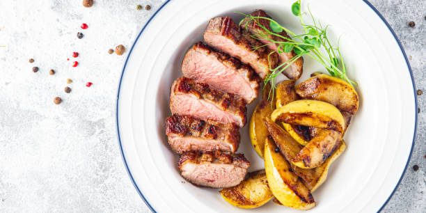 istock duck breast meat and garnish poultry second course fresh meal snack on the table copy space food background 1343595695