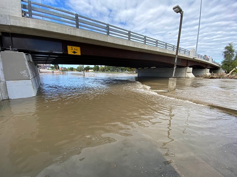 Image of a bridge over a flooding river in Chatham Ontario after a rainy week in the September