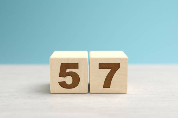istock Wooden toy blocks forming the number 57. 1343600268