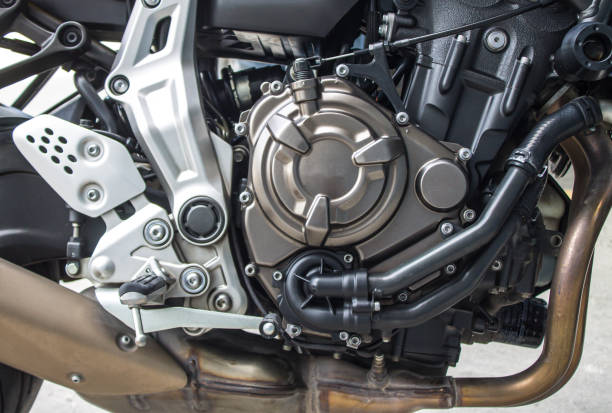 istock Titanium color motorcycle engine, black gear cooling line. brown muffler.silver 1343608235