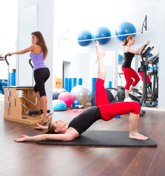 istock Aerobics pilates gym women group and crosstrainer 1343610852