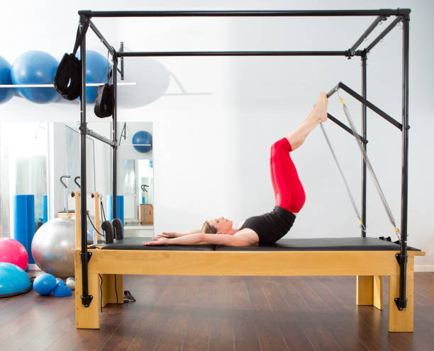 istock Pilates aerobic instructor woman in cadillac 1343611050