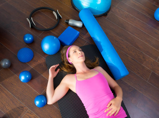 istock Aerobics woman tired resting lying on mat 1343612380
