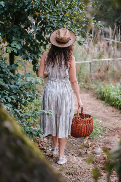 istock A young woman goes to pick apples 1343614040