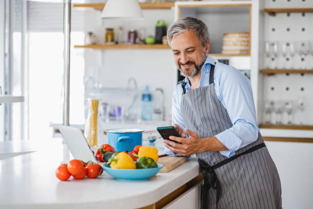 istock Man preparing a healthy meal at home 1343615547