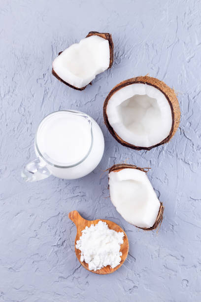 istock Vegan powdered milk made from coconut, powder and dissolved with water, vertical, top view 1343616358