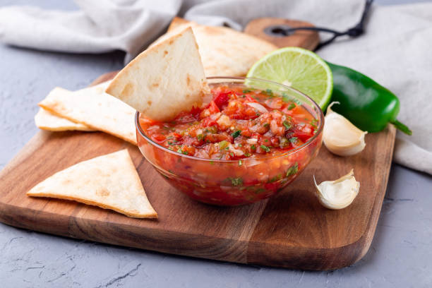 istock Salsa Asada sauce with tortilla chips and lime 1343617425