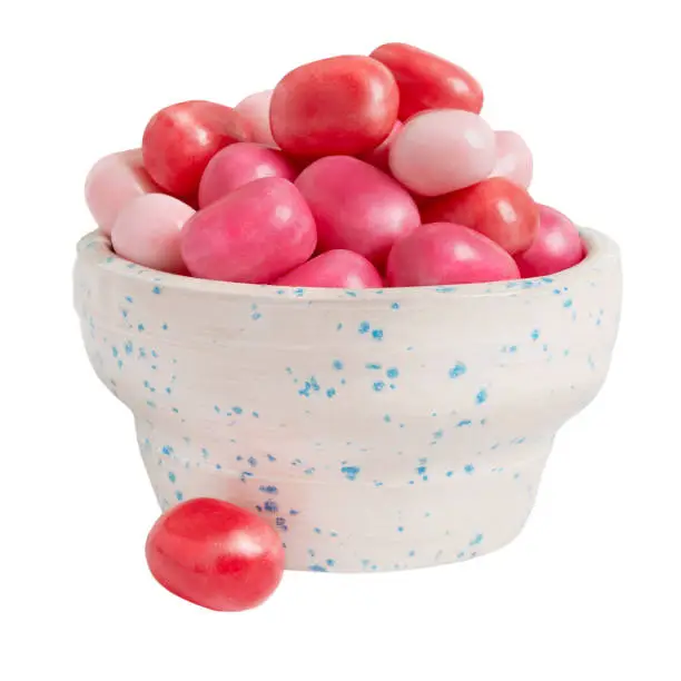 Photo of Popular round chewing gum in a bowl isolated on white background. Delicious sweets for the holiday.