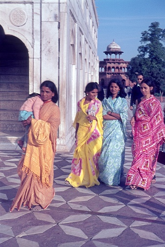 Agra, Uttar Pradesh, India, 1972. Indian women in traditional dresses at the Taj Mahal.