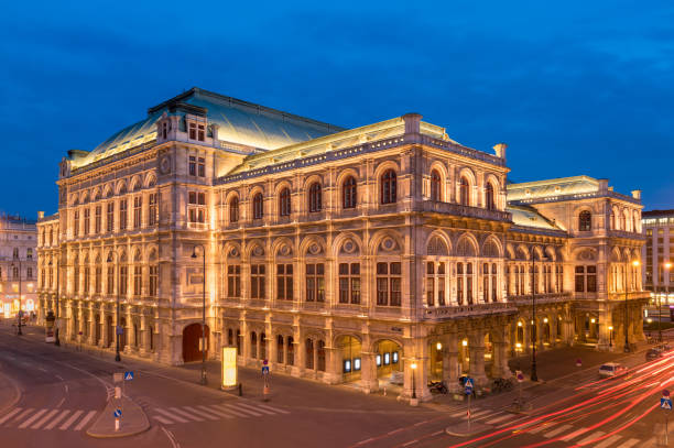 Vienna, Austria, Europe. Wide angle view of Vienna State Opera House at twilight. This Opera House was built in 1869.