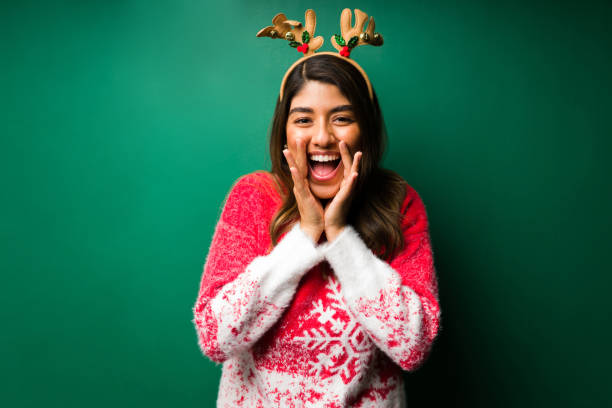 istock Hispanic woman shouting a sale offer 1343619662