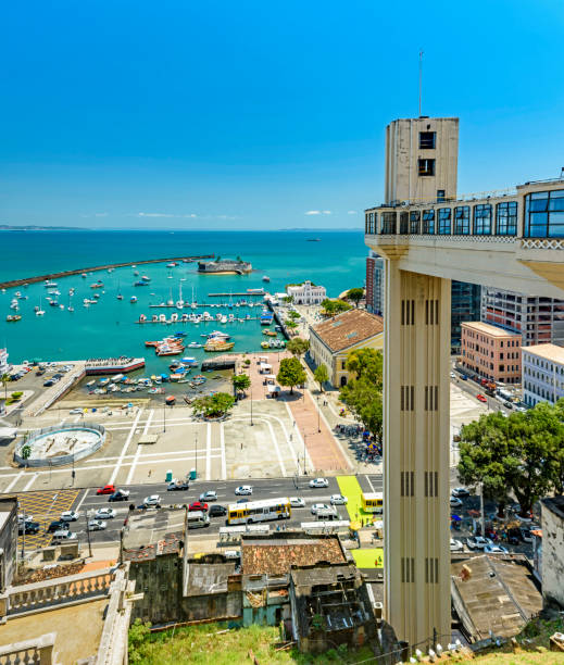 Panoramic view of the bay of All Saints and Lacerda elevator in the city of Salvador Panoramic view of the bay of All Saints with boats and Lacerda elevator in the city of Salvador in Bahia on a sunny day. lacerda elevator stock pictures, royalty-free photos & images
