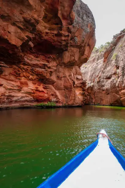 Photo of Boat on canyon of San Francisco river, Sergipe, Brazil. Green waters and orange walls