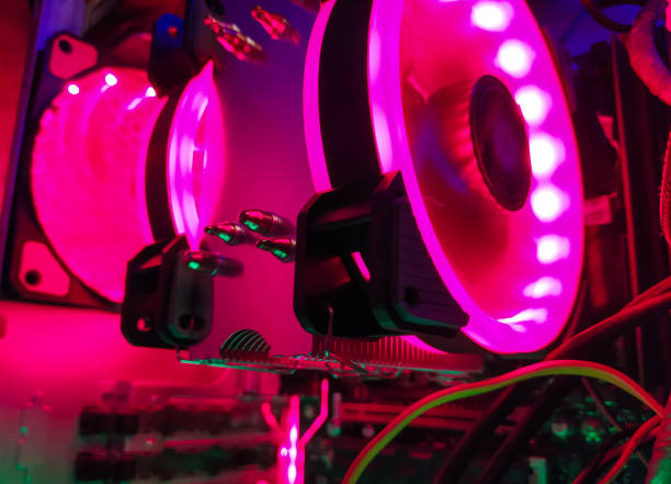 istock Modern computer air cooling with multi-colored led backlight-fans, cooling radiators, cables, boards, close-up, macro. 1343626073