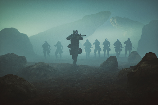 Soldados futuristas caminando sobre terreno rocoso photo
