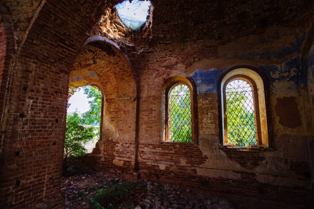 istock Old ancient abandoned red brick ruins overgrown by plants 1343633251