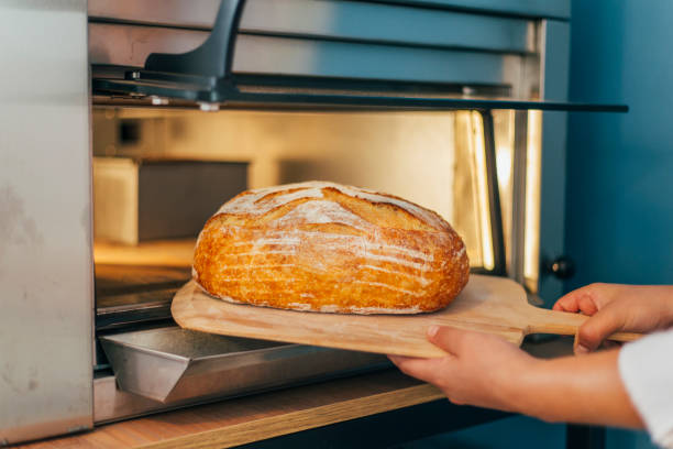 istock Woman Making Bread from the Oven 1343633432