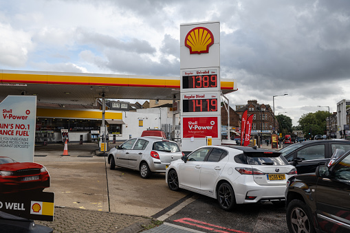 Car queue to Shell station on Upper Clapton Rd in North London. Fuel crisis caused by a purchasing panic among drivers and limited distribution in the UK due to a shortage of HGV drivers.