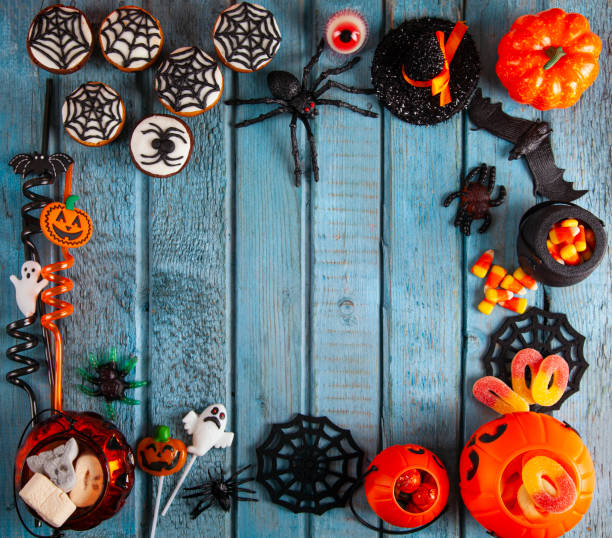 istock Halloween party decorations frame on blue wooden rustic table 1343634663