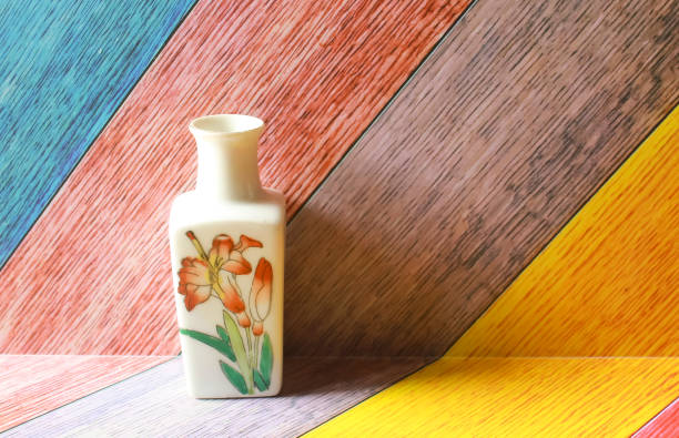 Photo of a small ceramic jar decoration on a colorful abstract background