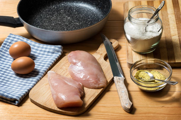 istock Chicken fillet on a cutting board 1343639384