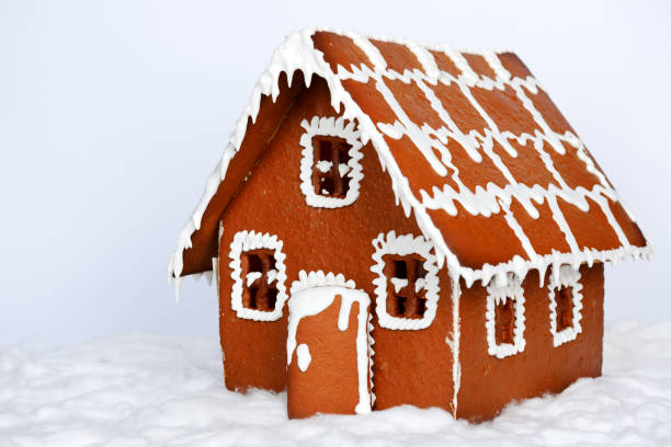 istock The hand-made eatable gingerbread house and snow decoration 1343640190