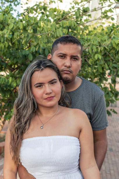 istock Couple In Front Of A Tree Outdoors. 1343642417