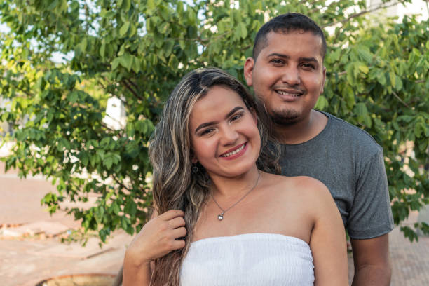 istock Couple In Front Of A Tree Outdoors. 1343642501