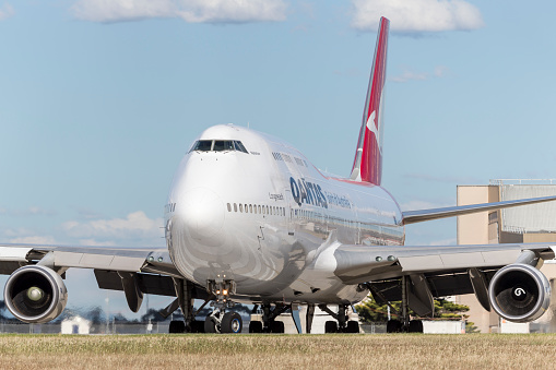 Melbourne, Australia - January 16, 2015: Qantas Boeing 747-438ER VH-OEE lining up on the runway at Melbourne International airport.