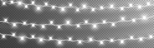 ilustrações de stock, clip art, desenhos animados e ícones de christmas lights string. silver garlands on transparent background. luminous light bulbs for poster. realistic glowing elements for greeting card. vector illustration - twinkle lights