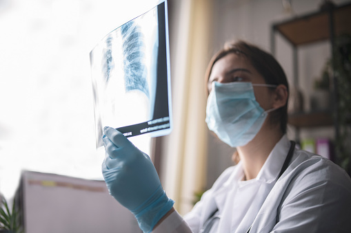Medical Worker Analyzing X-Ray Picture Of Lungs