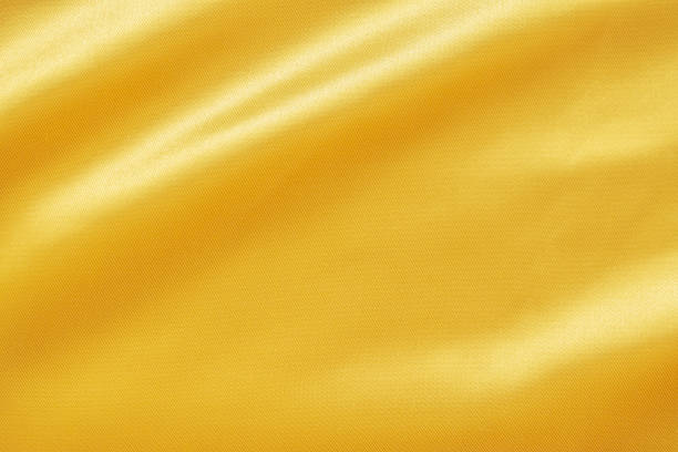 istock Abstract luxury gold fabric with soft wave texture background 1343651297