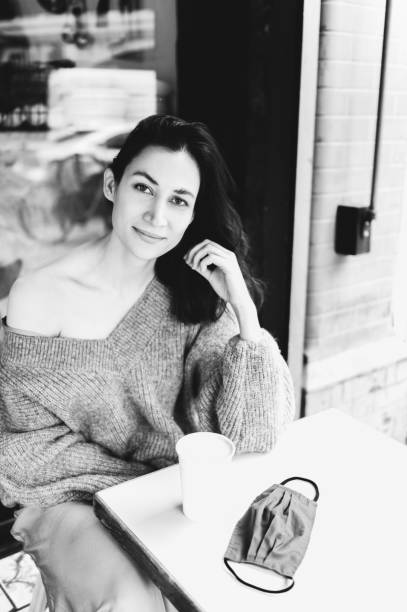 istock Young lady is drinking coffee at the cafe 1343652210